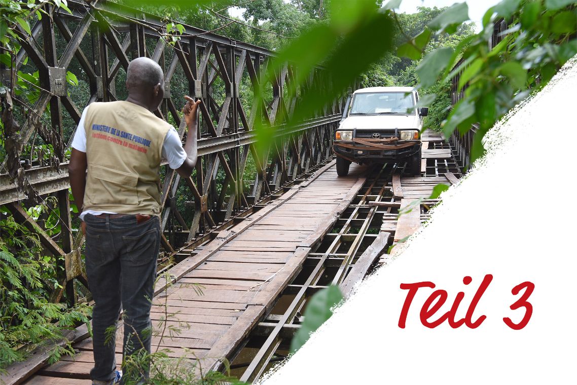 Ein Auto fährt über eine Brücke. An der Seite steht: Teil 3